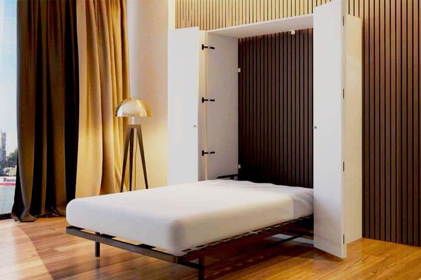 Wall bed with enclosing cabinet in a modern room